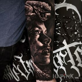 Tattoo Realistic Medusa on the forearm motif: black and gray style: realistic