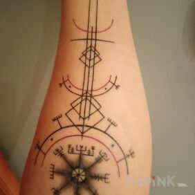Tattoo Viking Compass on the forearm motif: black and gray style: geometric