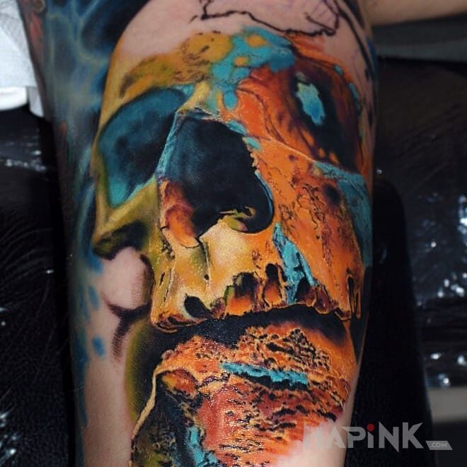 Tattoo Kolorowa czaszka in skulls motif and realistic style on the forearm