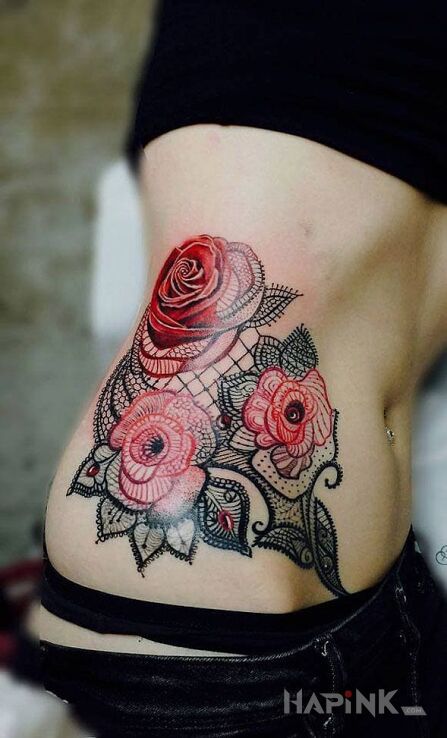 Tattoo Czerwone róże in flowers motif on the ribs