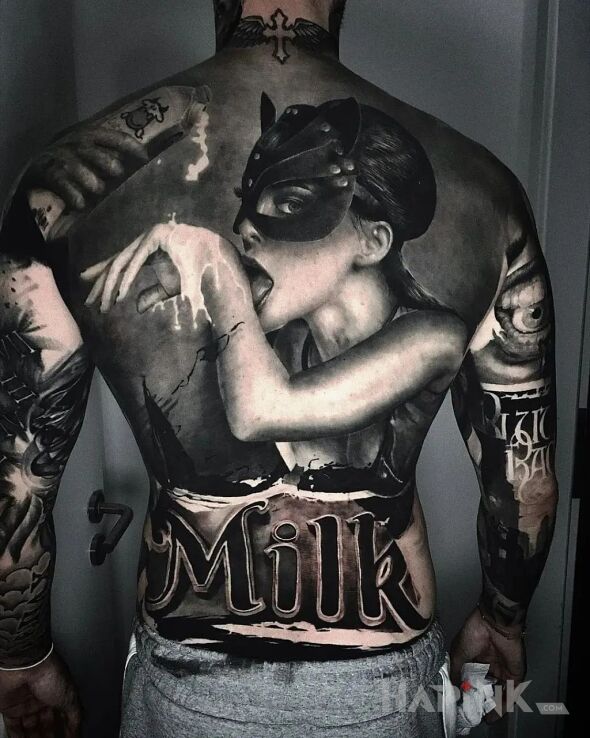 Tattoo Mleko in black and gray motif and realistic style on the shoulder blades