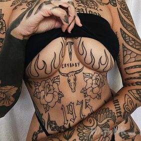 Tattoo Outlined on the breast motif: flowers style: contour / linework
