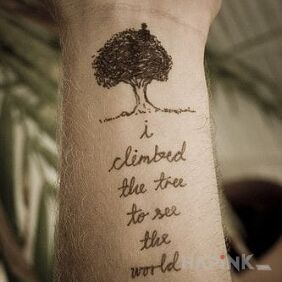 Tattoo On the tree on the forearm motif: lettering