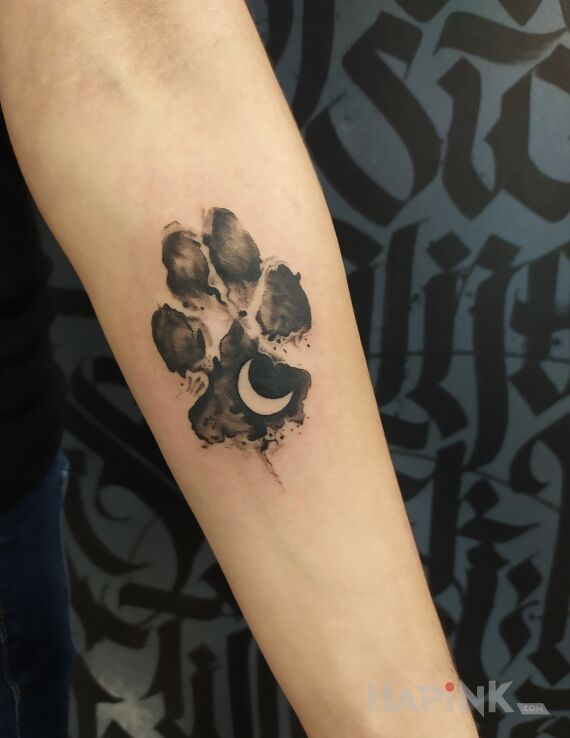 Tattoo Łapka in black and gray motif and graphic / illustrative style On the arm