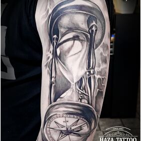 Tattoo Hourglass, time, compass On the arm motif: black and gray style: realistic