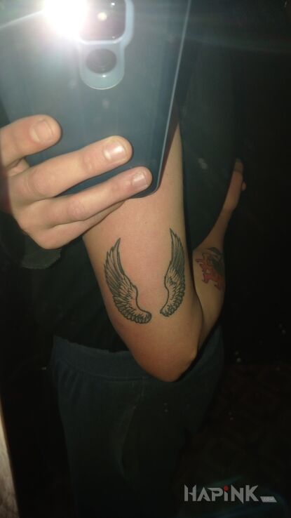 Tattoo Skrzydełka in black and gray motif and graphic / illustrative style On the arm