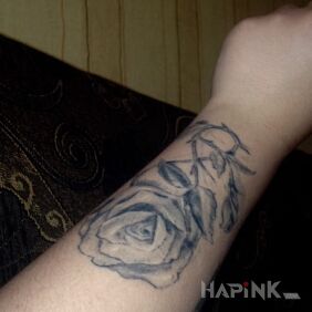 Tattoo Roza on the forearm motif: flowers