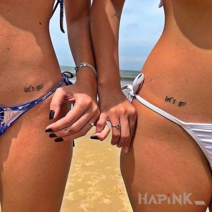 Tattoo Let's go! in lettering motif and minimalistic style on the hip