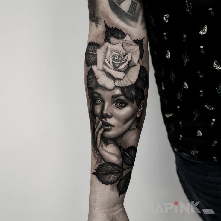 Tattoo Portret z różą in faces motif and realistic style on the forearm