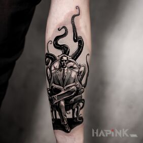 Tattoo H.P. Lovecraft on the forearm motif: dark style: realistic