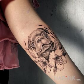Tattoo Pug in flowers On the arm motif: flowers style: realistic