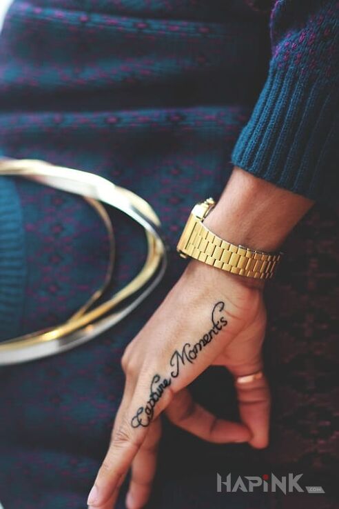 Tattoo Capture moments in lettering motif on the hand