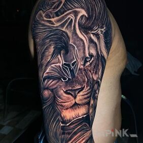 Tattoo Combination of a lion and a warrior on the upper arm motif: characters style: realistic