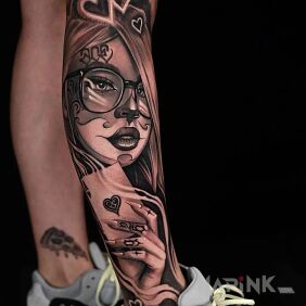 Tattoo Ace up her sleeve on the calf motif: black and gray style: realistic