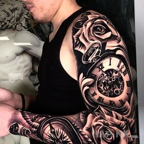 Tattoo Pocket watch On the arm motif: black and gray style: realistic