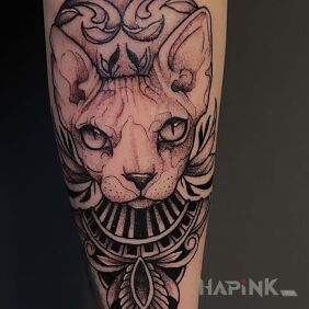 Tattoo Kitty on the forearm motif: black and gray style: graphic / illustrative