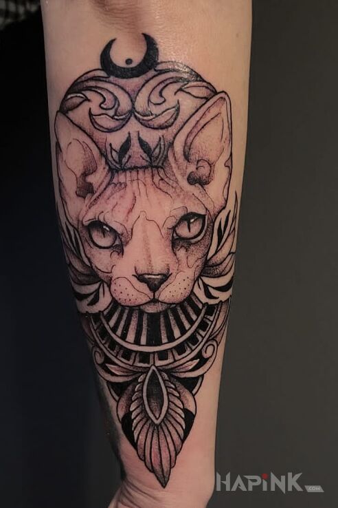 Tattoo Kiciuś in black and gray motif and graphic / illustrative style on the forearm