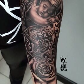 Tattoo Cupid with roses on the forearm motif: angels style: realistic
