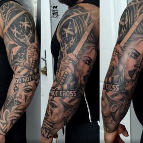 Tattoo Biker face sleeve On the arm motif: black and gray style: realistic