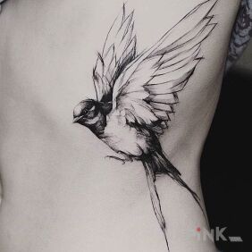 Tattoo Bird in flight on the ribs motif: animals