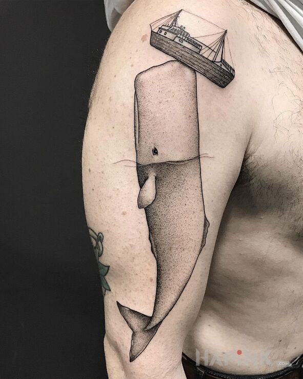 Tattoo Moby Dick in animals motif on the upper arm