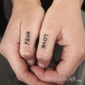 Tattoo Fear / Love on the fingers motif: lettering