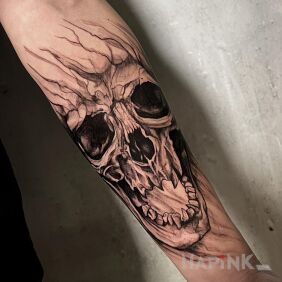 Tattoo Skull by Madzia on the forearm motif: black and gray style: graphic / illustrative