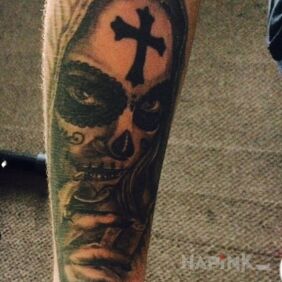 Tattoo Santa muerte on the forearm motif: faces