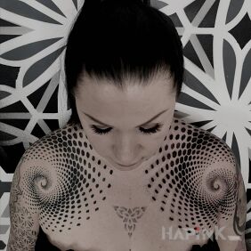 Tattoo Two spirals on the chest motif: black and gray style: geometric