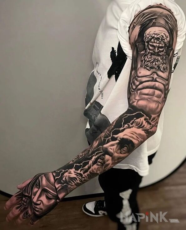 Tattoo Atlas in faces motif and graphic / illustrative style on the hand