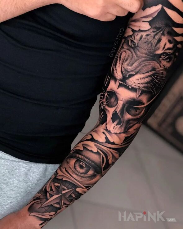 Tattoo Czaszka pogryziona przez tygrysa in animals motif and realistic style On the arm