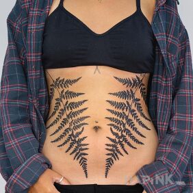 Tattoo Two not so small ferns on the stomach motif: floral style: realistic