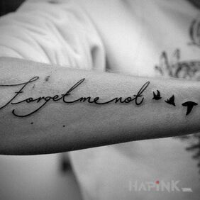 Tattoo Forget me not on the forearm motif: lettering