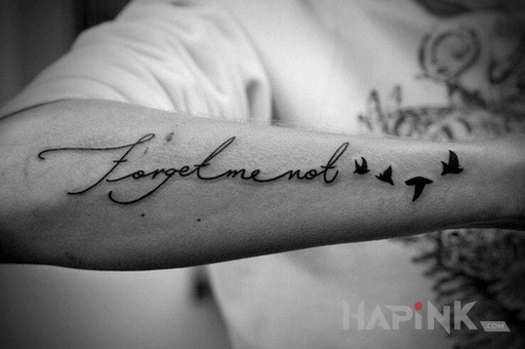 Tattoo Forget me not in lettering motif on the forearm