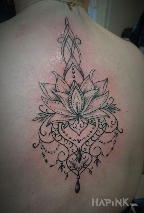 Tattoo Mała przeróbka in black and gray motif and graphic / illustrative style on the back