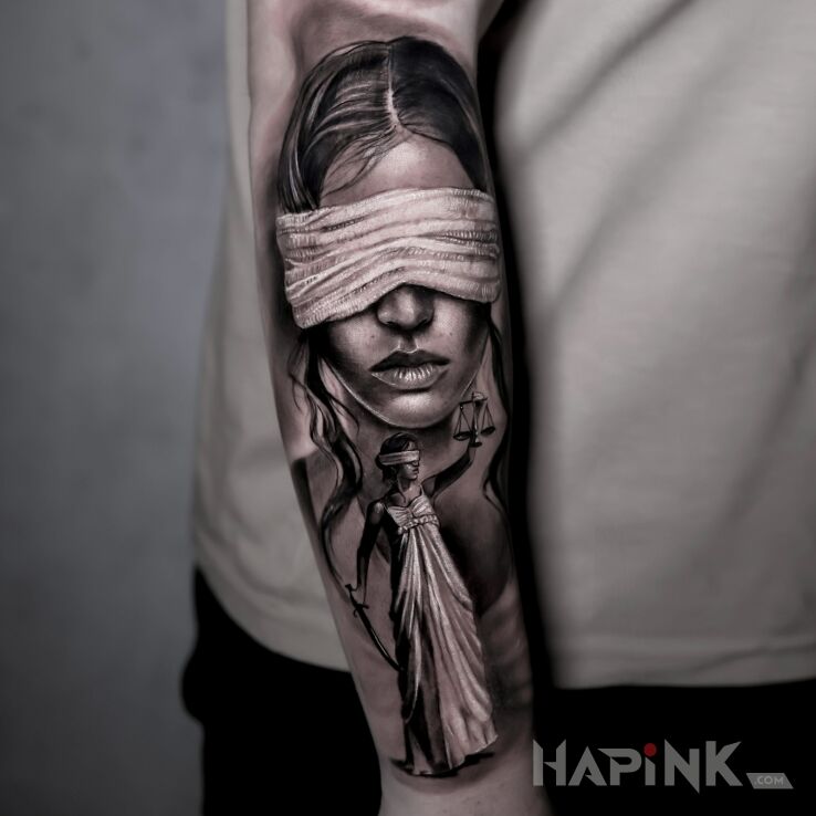 Tattoo Temida in faces motif and realistic style on the forearm