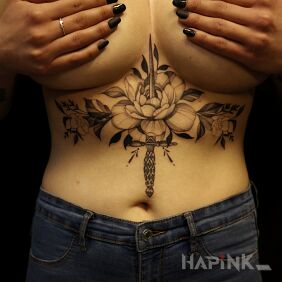 Tattoo Floral composition and dagger on the stomach motif: flowers style: graphic / illustrative