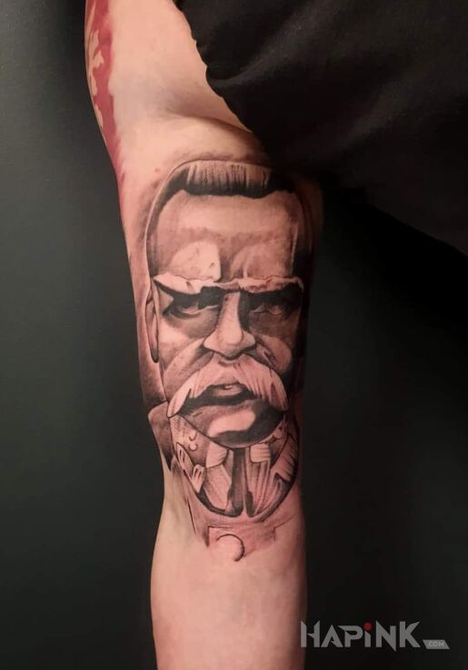 Tattoo Pilsudzki in black and gray motif and graphic / illustrative style On the arm