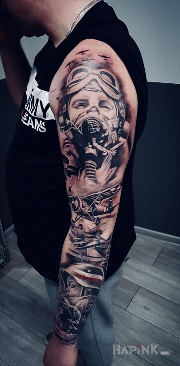 Tattoo Rękaw in war motif and realistic style On the arm
