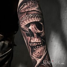 Tattoo Skull with a snake On the arm motif: skulls style: realistic