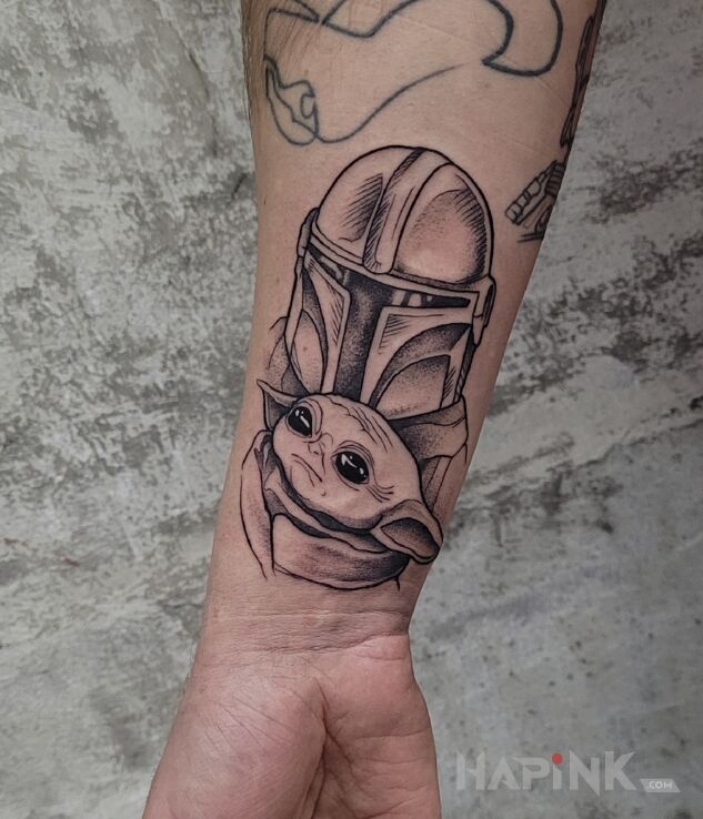 Tattoo Star Wars in black and gray motif and graphic / illustrative style On the arm