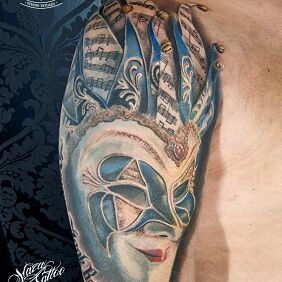 Tattoo Carnival mask On the arm motif: colorful style: realistic