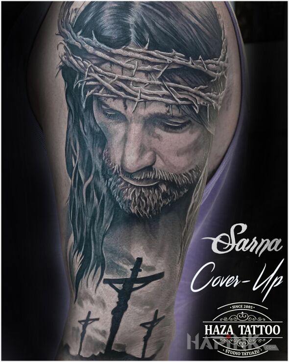 Tattoo Jesus cover in cover-up motif and realistic style on the upper arm
