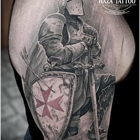 Tattoo Knight on the upper arm motif: black and gray style: realistic