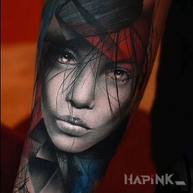 Tattoo Little face on the forearm motif: colorful style: realistic