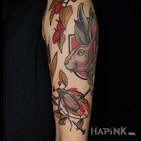 Tattoo Wildness on the upper arm motif: floral style: newschool