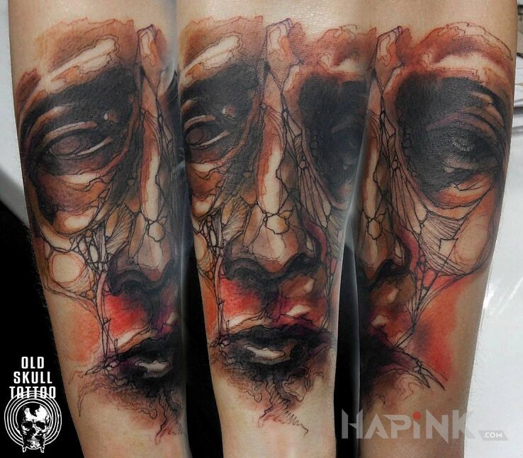Tattoo Niepokojąca twarz in faces motif and Watercolor style on the forearm