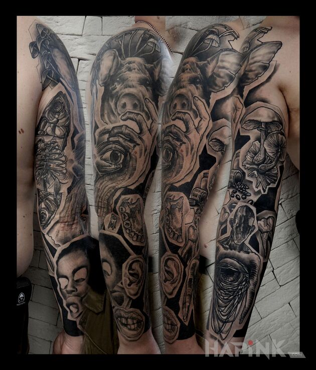 Tattoo Zło in black and gray motif and surrealistic style on the shoulder