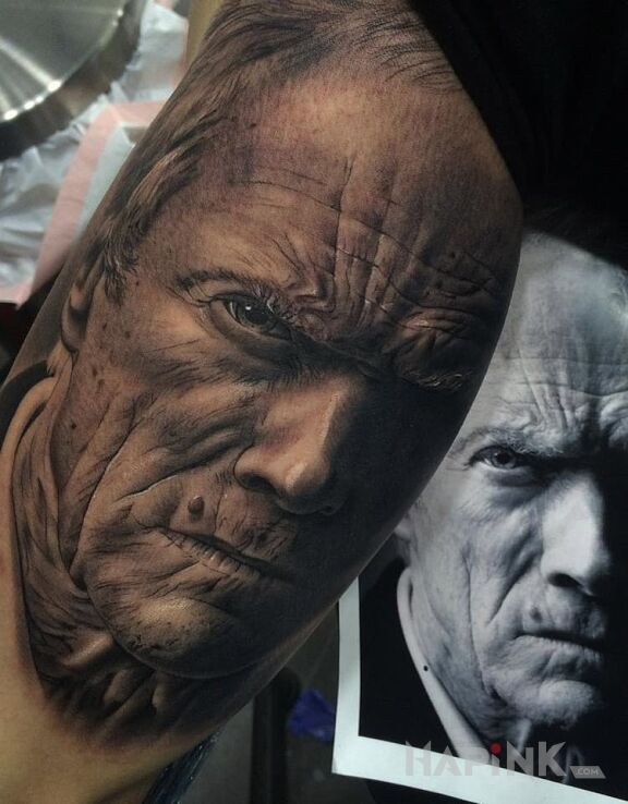 Tattoo Clint Eastwood in 3D motif and realistic style on the upper arm
