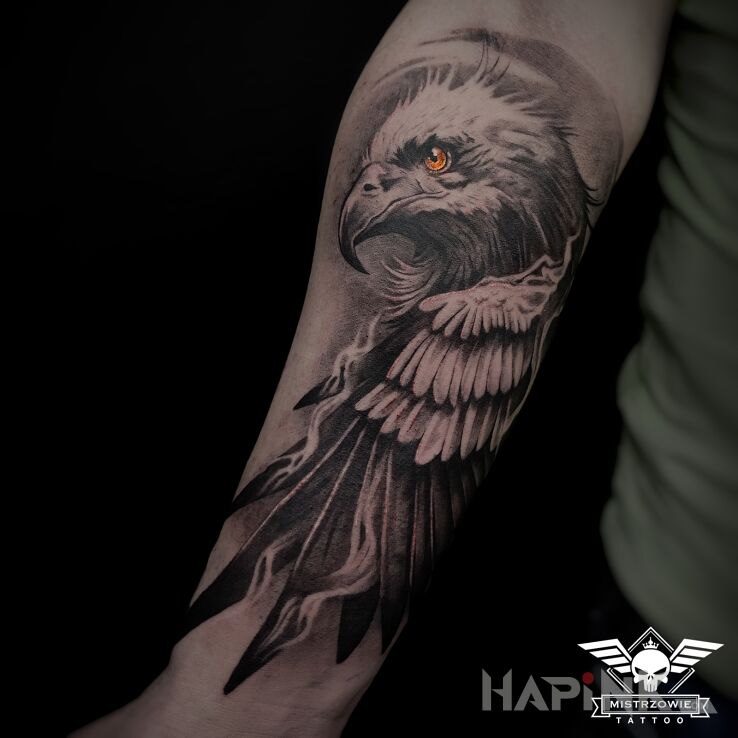 Tattoo Orzeł in wings motif and realistic style on the forearm